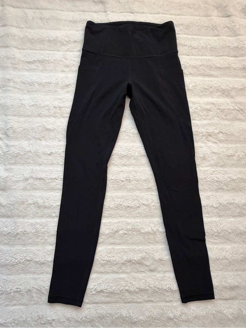 Athleta Black Stash Pocket Salutation Tight